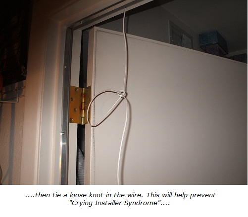 Home alarm wiring, tie a knot in the end of the wire