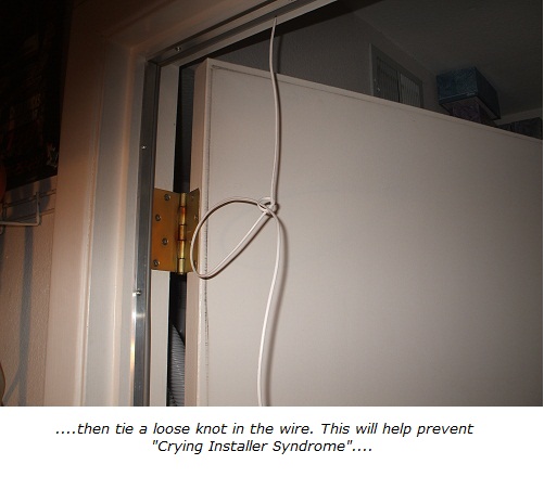 Home alarm wiring, tie a knot in the end of the wire