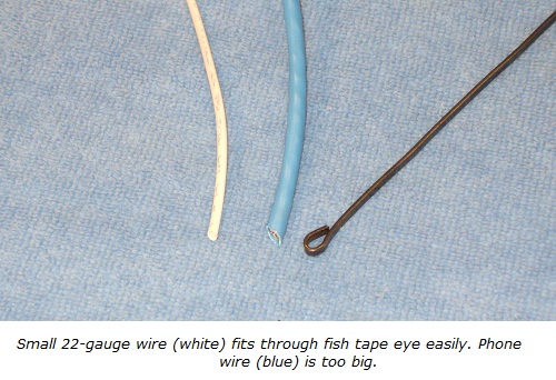 Fish tape with alarm wiring