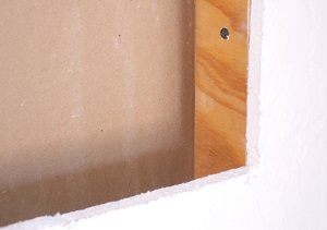 Small gap, shimmed with scrap plywood