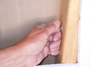 Brace being positioned using screw for handle