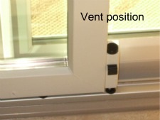 Vent door secured with foot bolt