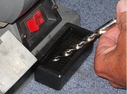 Sharpen drill bits, dipping in water