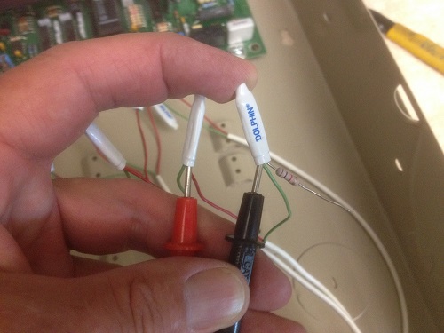 Metering crimp-connected alarm wiring