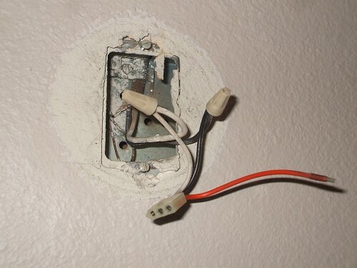 Disconnect the smoke alarm wiring by removing the wire nuts