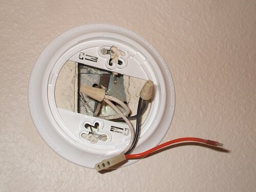 Install the new smoke detector base plate