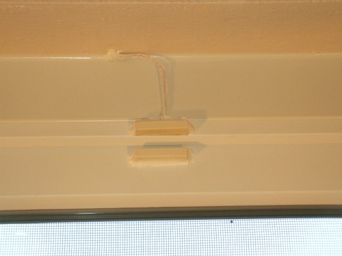 Magnetic reed switch and magnet after caulking