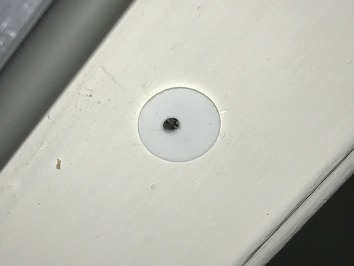 Hole drilled into magnetic reed switch body