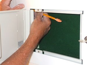 Install safe into opening and marking holes